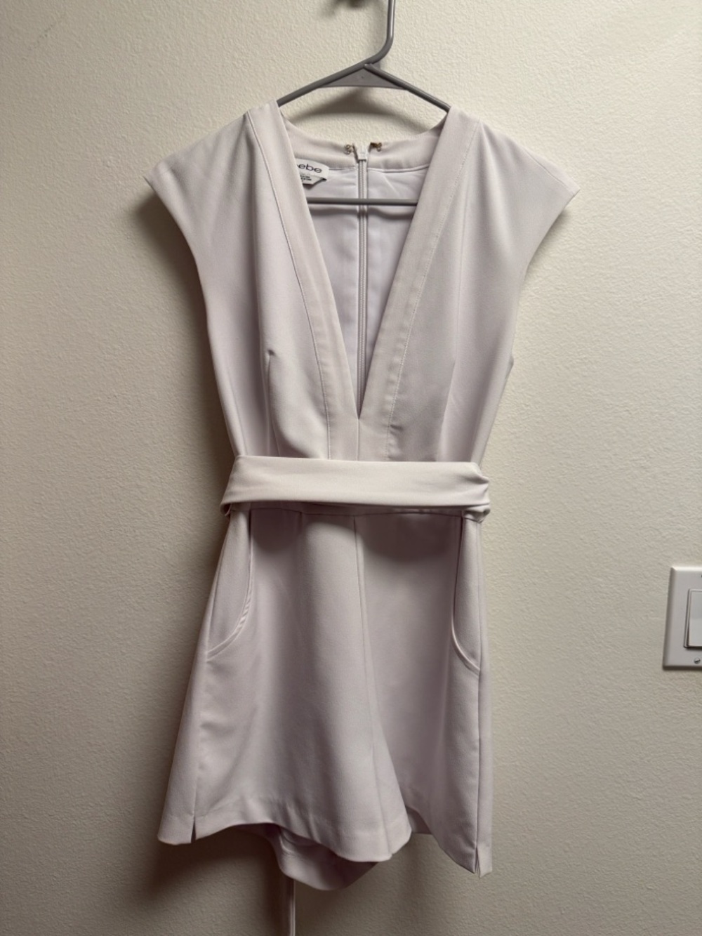 bebe Ivory Plunge V-Neck Romper with Waist Sash